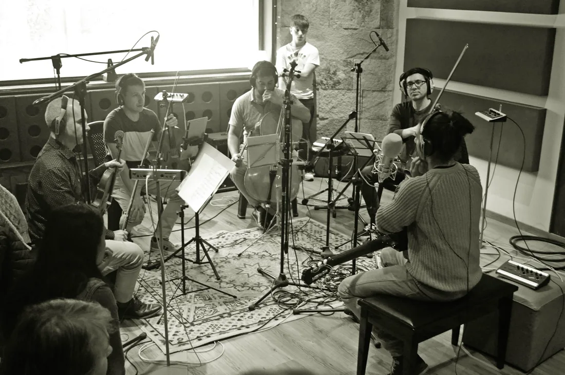 The musicians gathered for the string quartet recording session